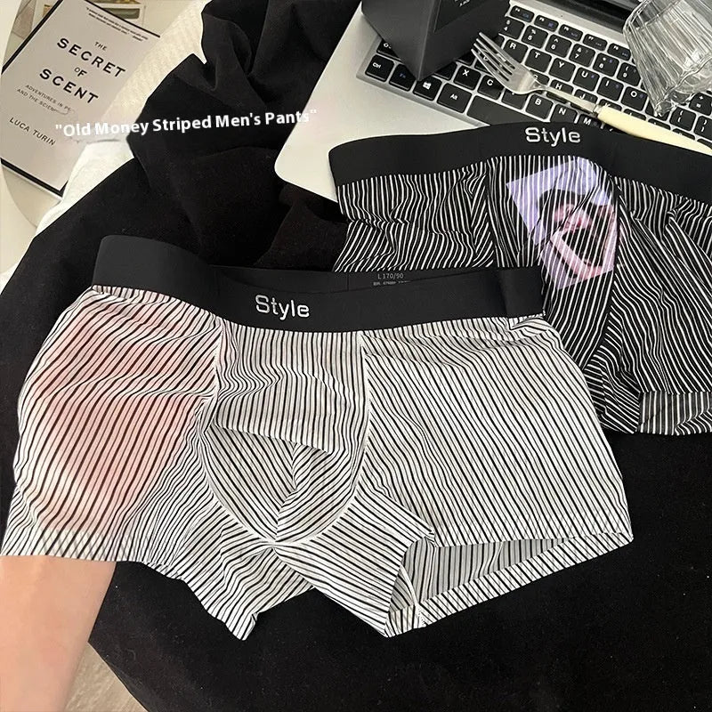 Men's ice silk boxer briefs in black showing seamless design and transparent crotch panel.