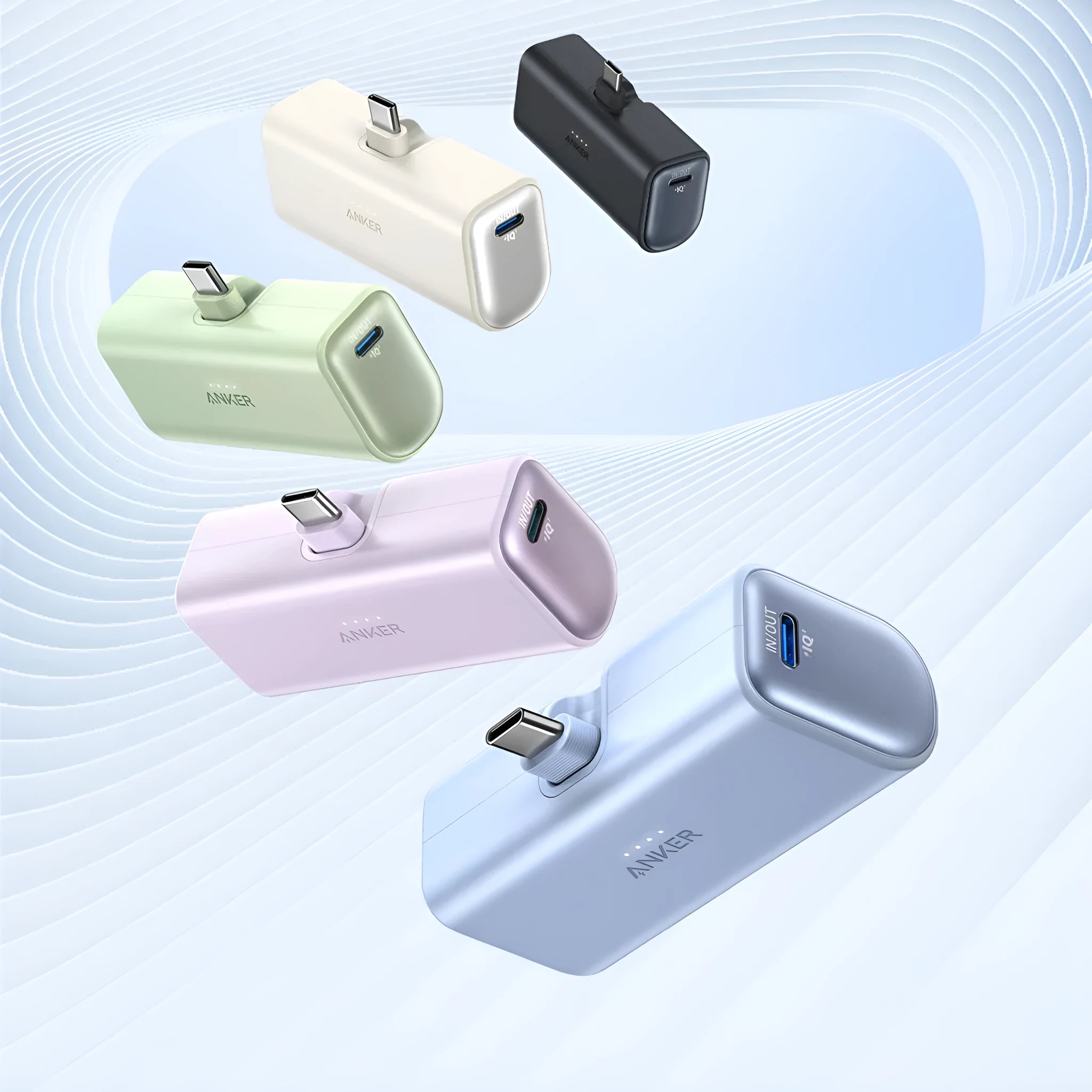Small capsule-shaped power bank in multiple colours showing USB-C port and compact size.
