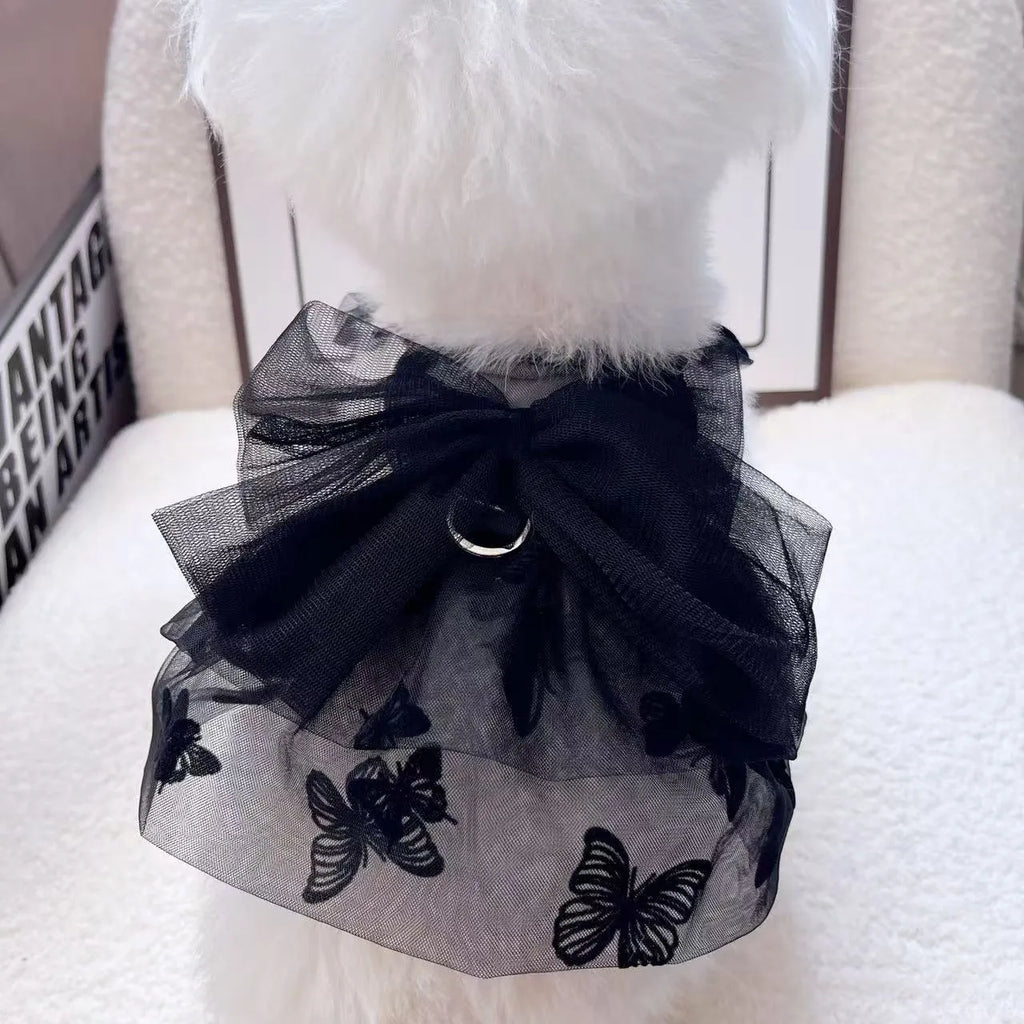 Black layered tulle princess skirt on a small dog, showing chest fit and full skirt silhouette.