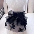 Black layered tulle princess skirt on a small dog, showing chest fit and full skirt silhouette.