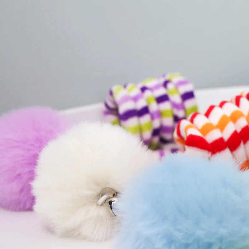 Hanging cat toy with coloured inflatable ball and suction cup attachment for doors and windows