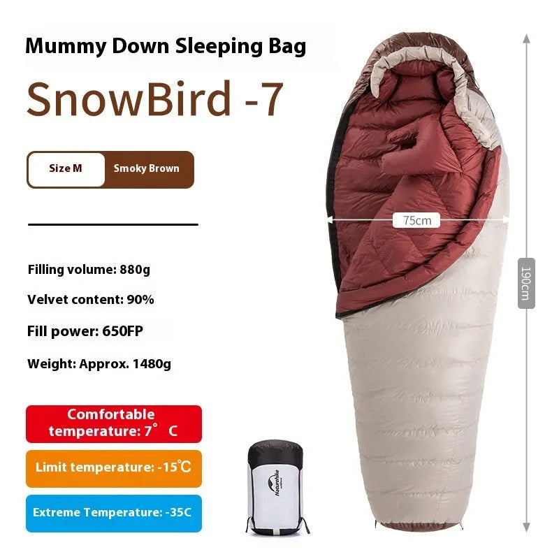 Adult mummy-style sleeping bag with goose down filling shown with its storage bag.