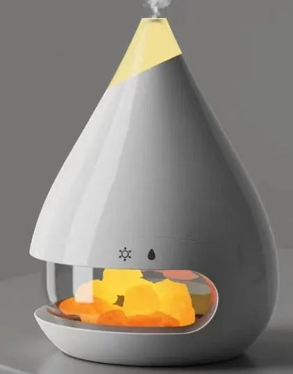 Square white flame humidifier aromatherapy machine with colourful 3D simulation flame on a desk.