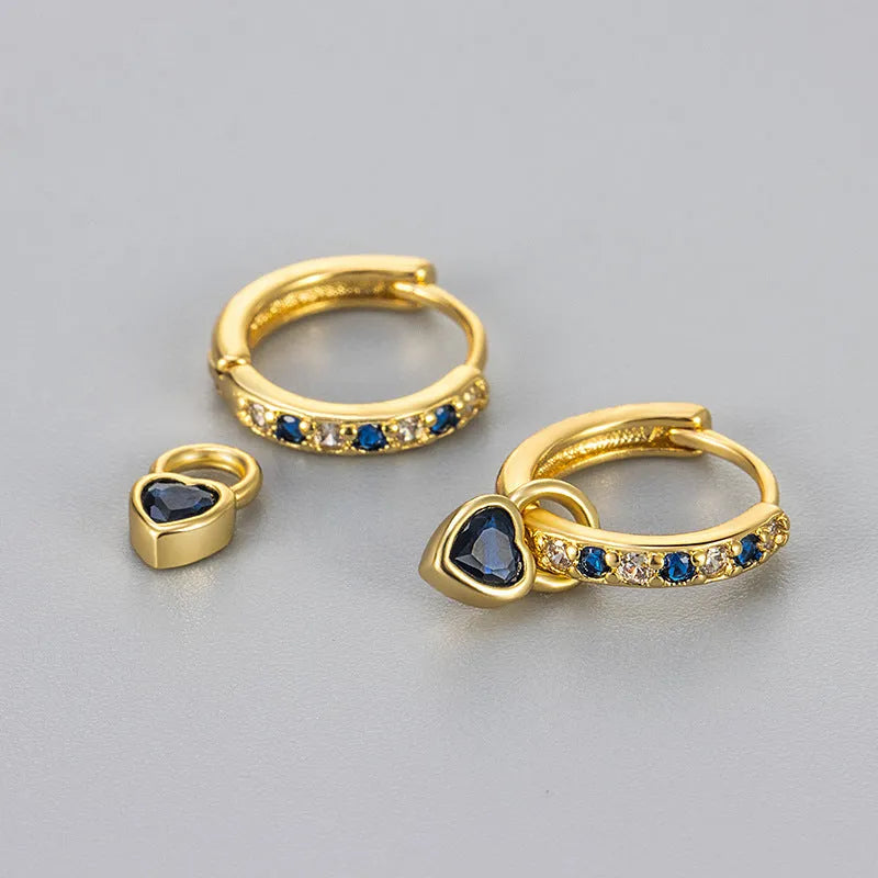 Gold-coloured clip-on earring for women with a heart-shaped drop featuring a pink zircon stone.