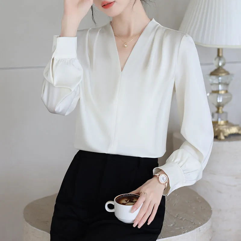 Women's blue satin shirt with long sleeves and slim fit showing 3D stitching detail