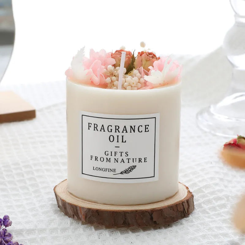 Decorative dried flower scented candle with choice of nine aromas on a wooden chip base.