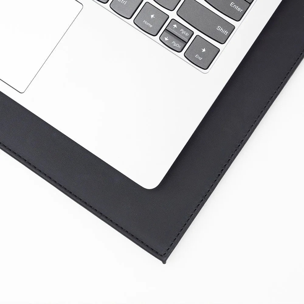 Durable black laptop cooling pad with printing pattern and anti-radiation features on a desk.