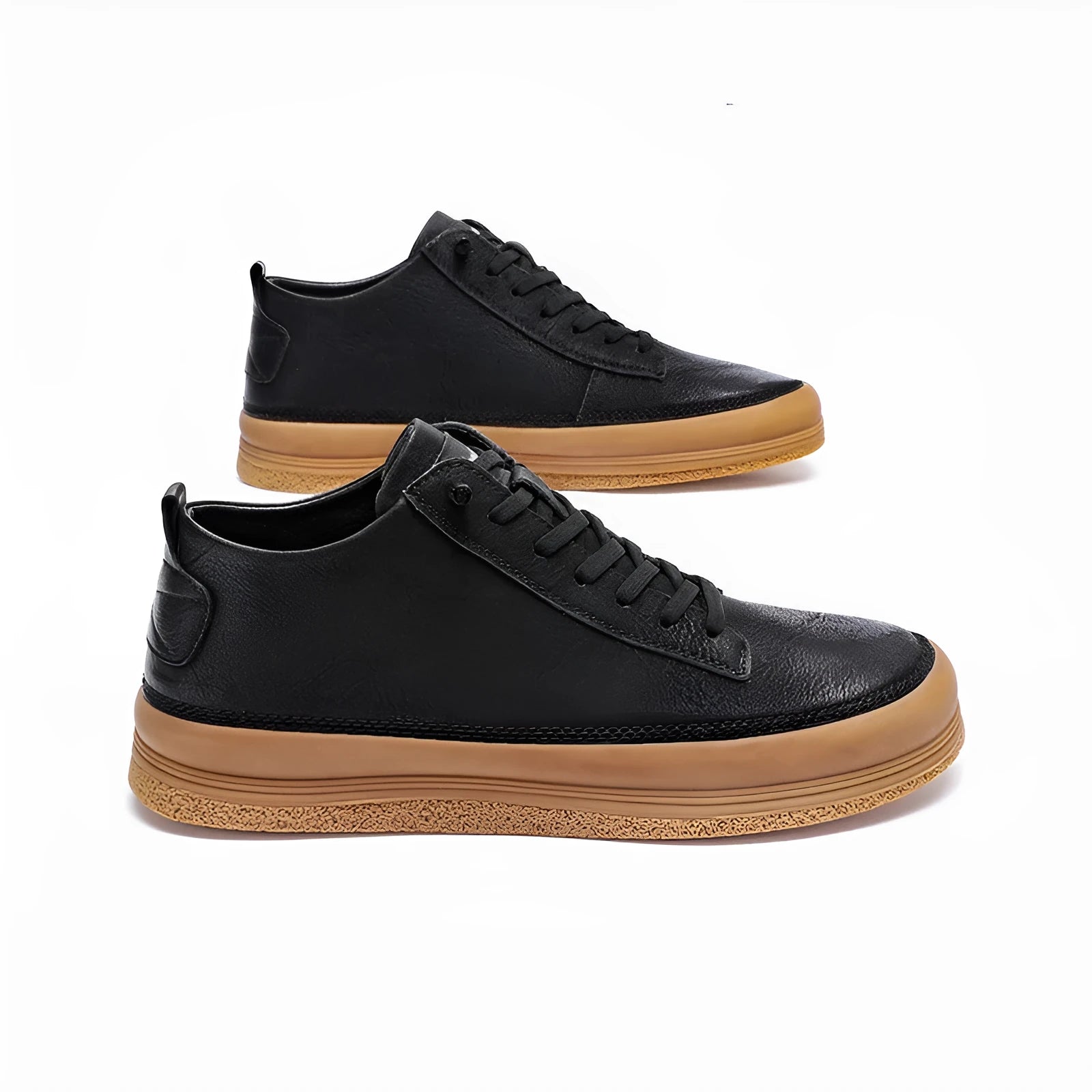 Men's black casual leather shoes with round toe and white rubber sole on a plain background.