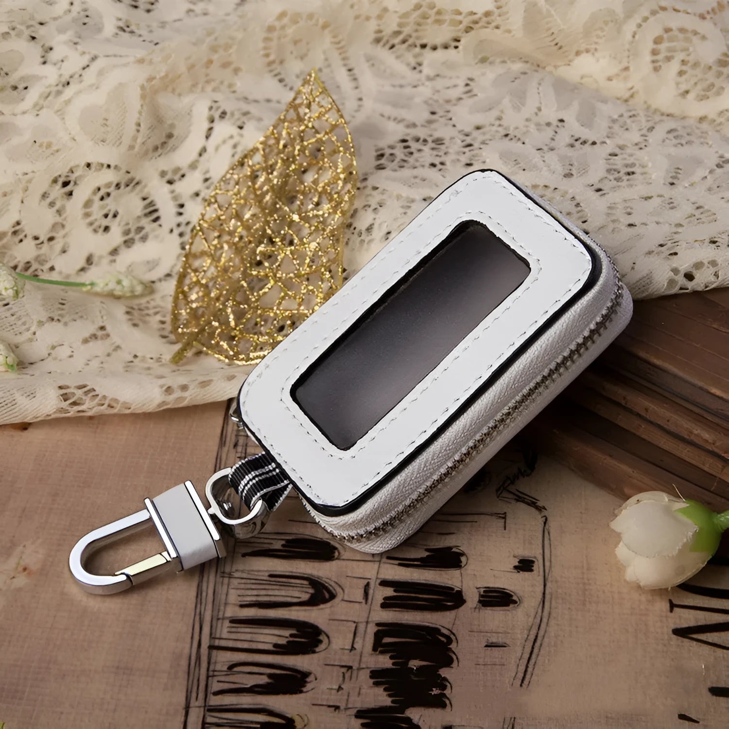 White genuine leather square car key case showing plain weave texture and dimensions.