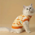 Orange cherry pattern cat sweater for autumn and winter wear, shown in pet clothing context.