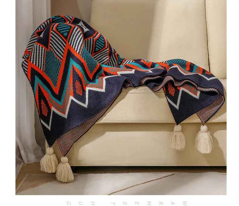 Bohemian-style acrylic knit sofa blanket with tassels in a geometric pattern