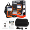Foxwell NT510 orange and black automotive diagnostic scanner with data cable on a workshop bench
