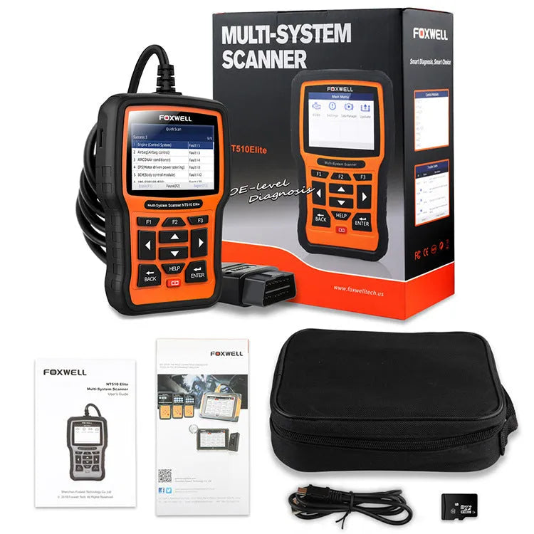 Foxwell NT510 orange and black automotive diagnostic scanner with data cable on a workshop bench