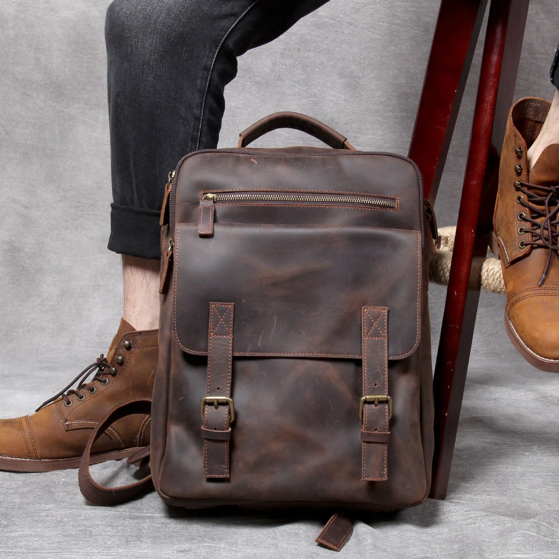Dark coffee coloured handmade leather backpack with internal organiser compartments.