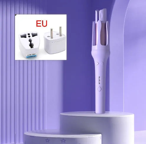 White and pink automatic hair curler with a 32mm rotating ceramic barrel and clamp, resting on a table with international power adapters.