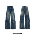 Man wearing verdant blue loose-fit jeans with curved seam detail and a vintage washed burst pattern.