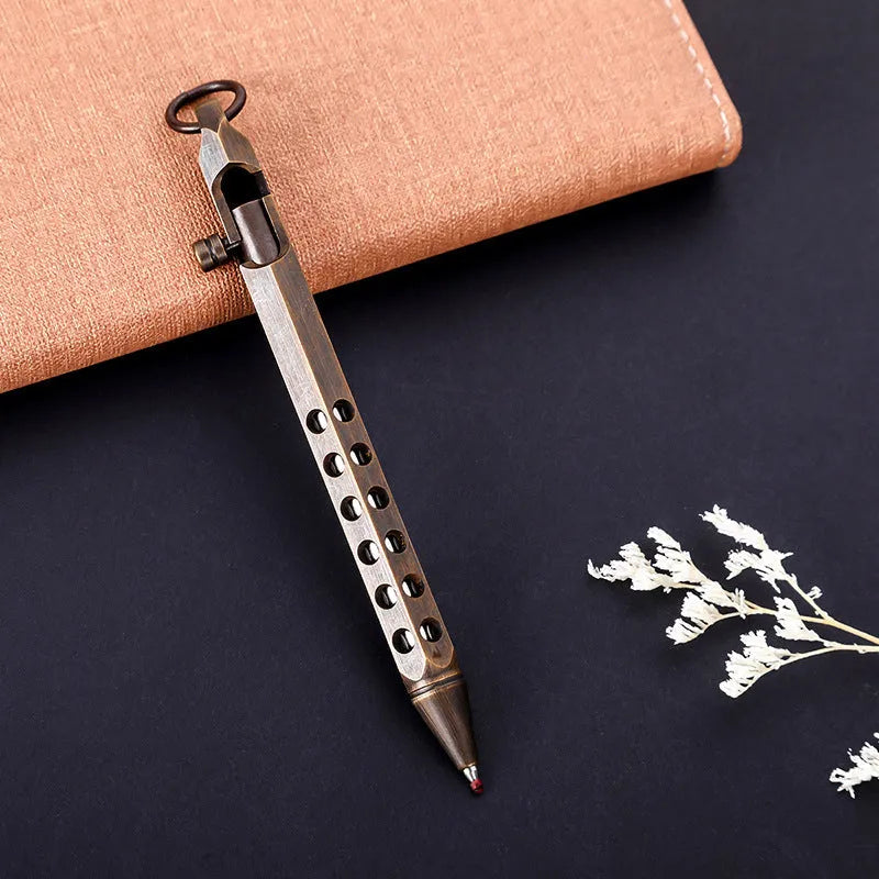 Brass hexagonal bolt-action pen showing six-angle design and bolt mechanism