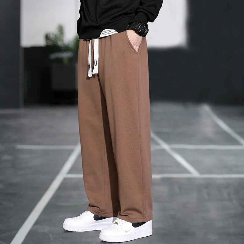 Men's grey Ninth Sports Pants showing high waist and multiple pockets.
