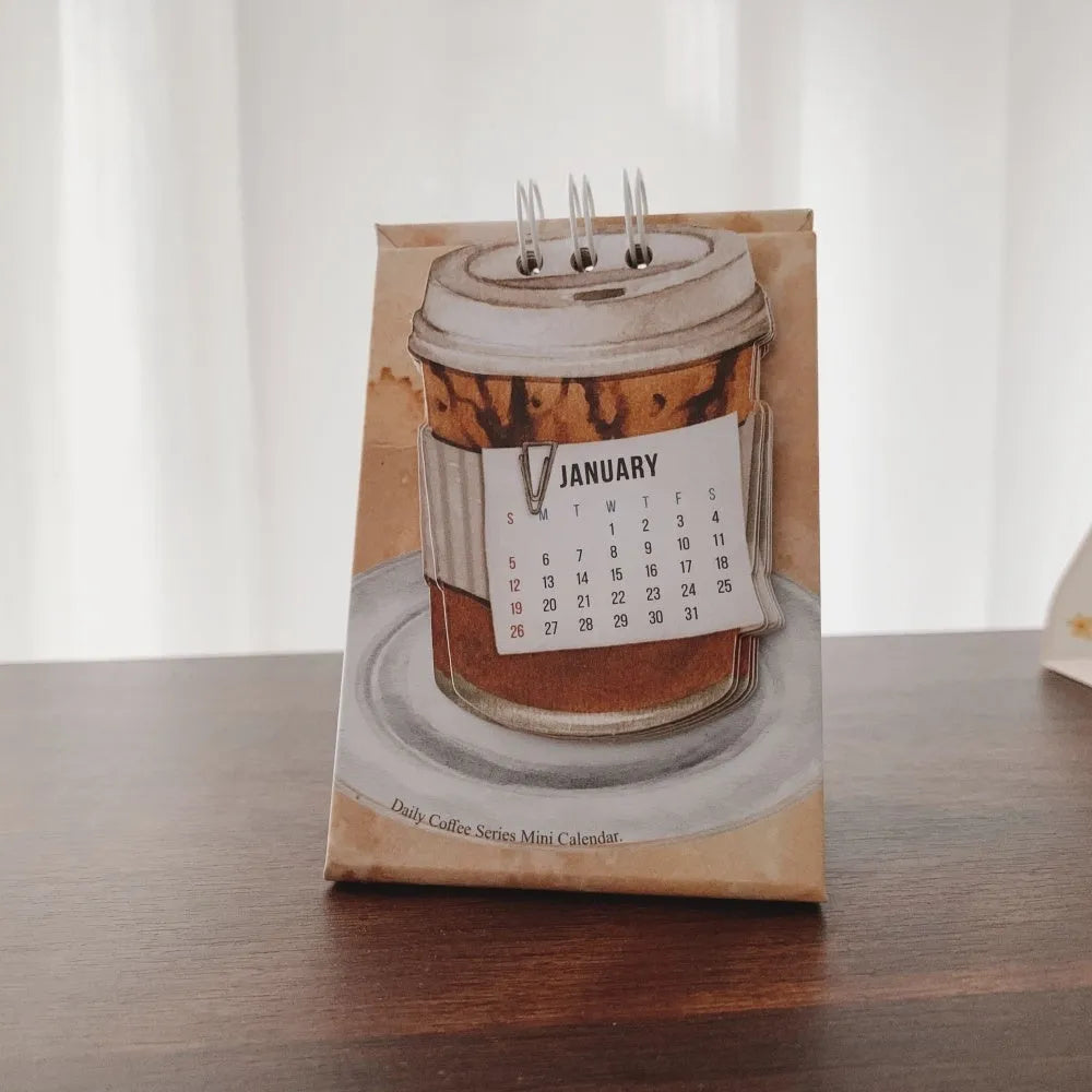 Four mini paper desk calendars for 2025 with different motivational themes in simple modern design