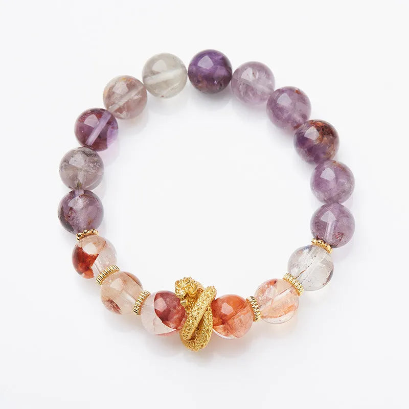 Purple cornucopia nine purple good luck crystal bracelet with zodiac animal motifs on wrist