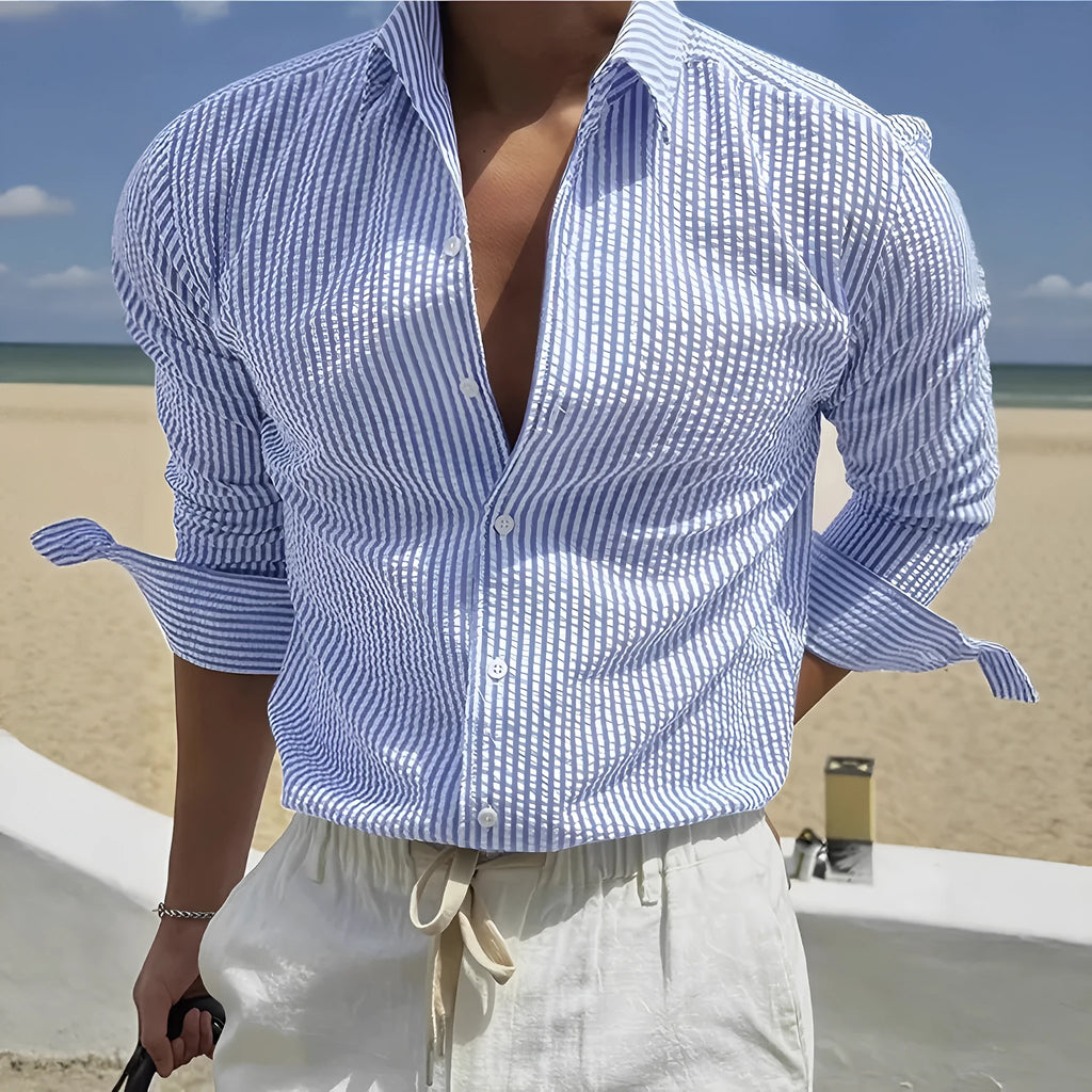 Men's blue striped long sleeve shirt with a cardigan lapel collar, laid flat.