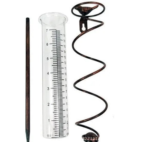 Cast iron outdoor garden rain gauge with hummingbird decoration and measurement scale.