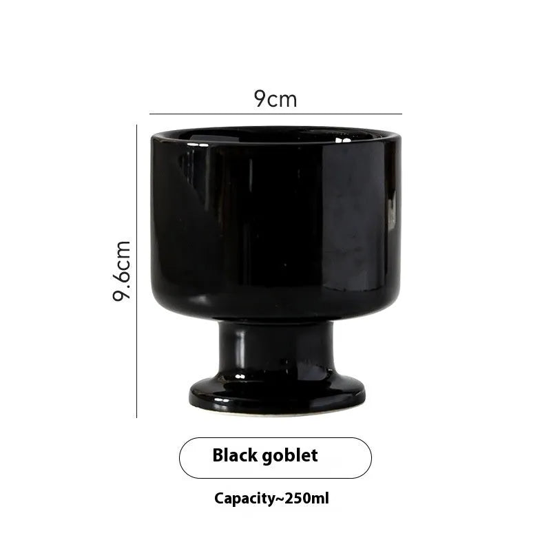 Handmade irregular solid colour ceramic mug on a table