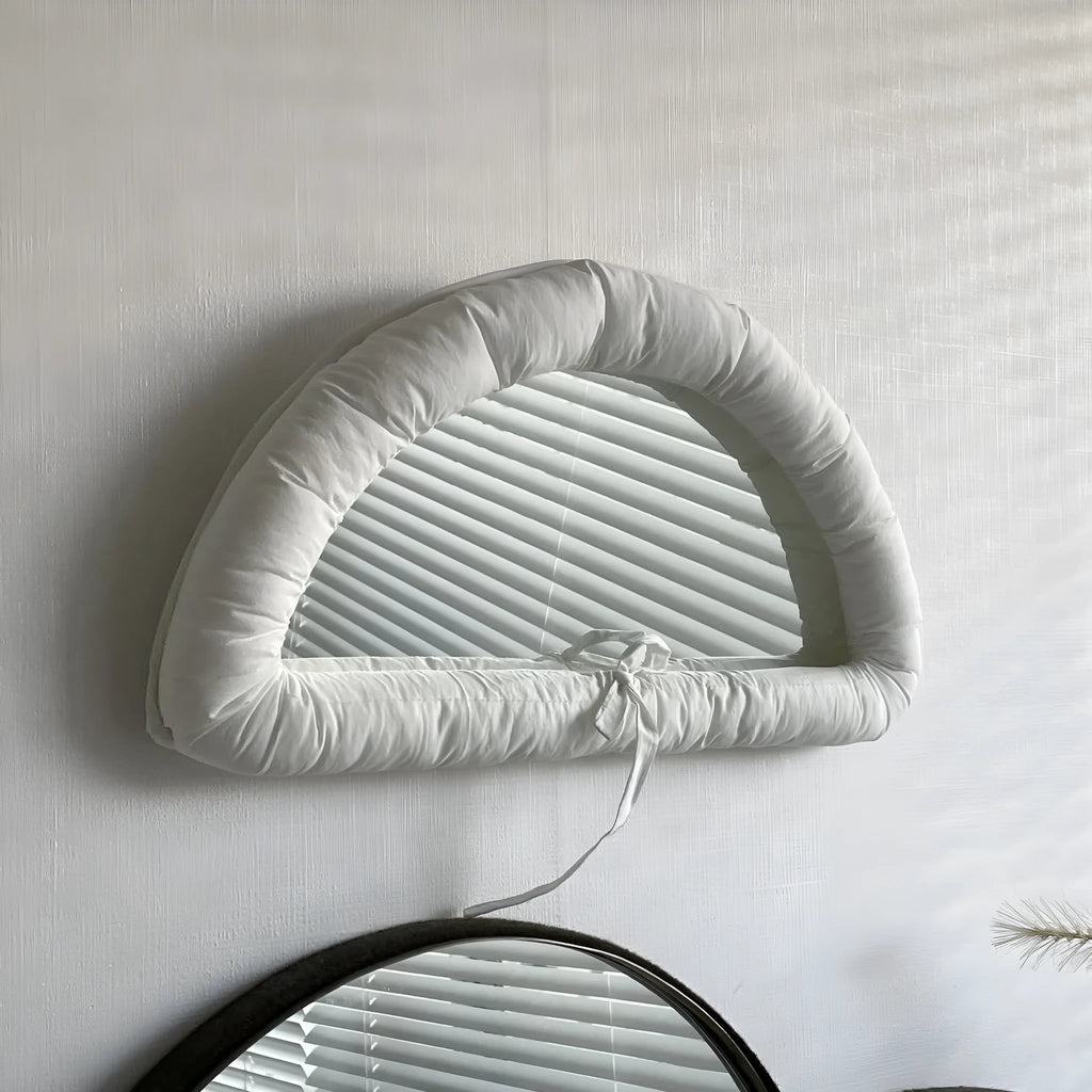 Hanging fabric mirror with soft cotton-filled backing in 23x40x5cm size