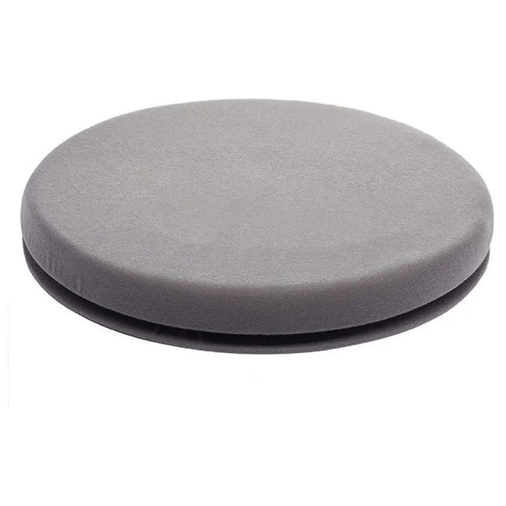 Grey rotating car seat cushion with a non-slip base on a car seat.