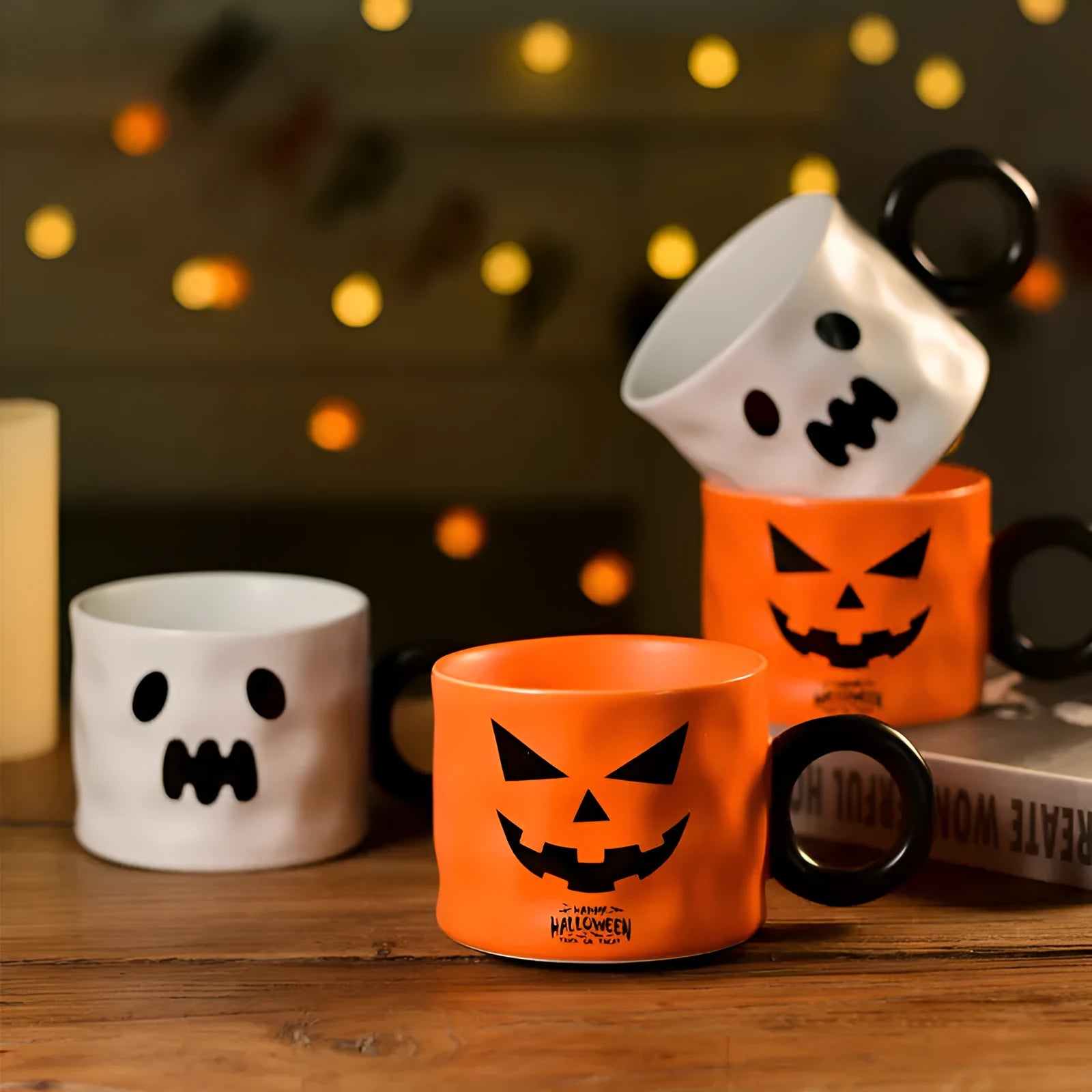 Orange ceramic pumpkin-shaped mug with handle on a table beside a dessert spoon and gift box.