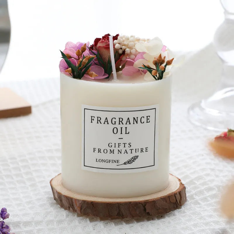 Decorative dried flower scented candle with choice of nine aromas on a wooden chip base.