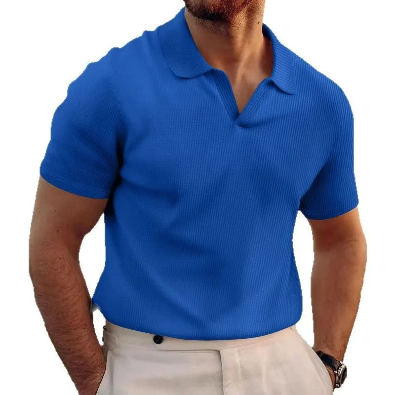 Man wearing a slim fit black heavy waffle knit t-shirt with short sleeves.
