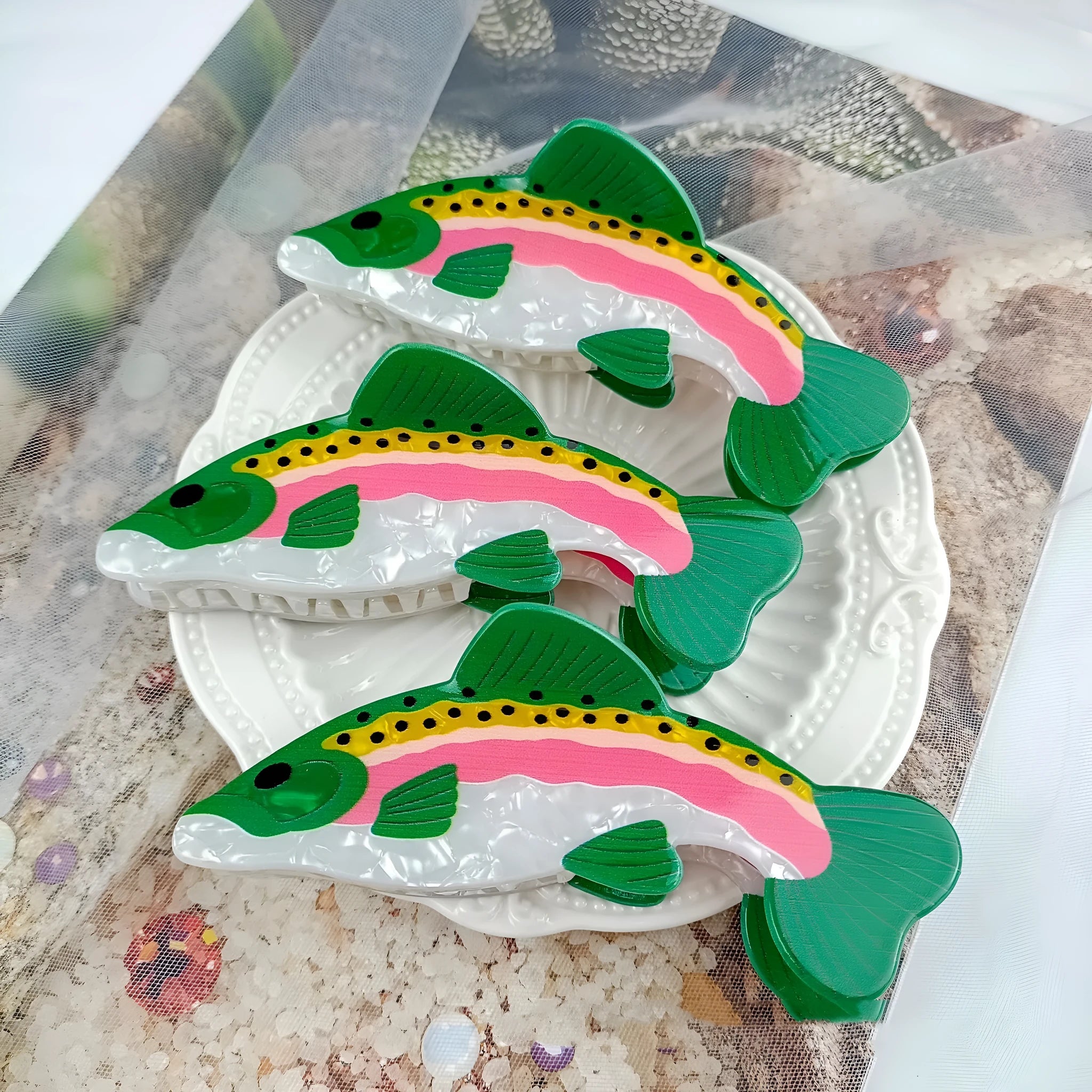 Dark green PVC hair clip featuring a printed rainbow trout and carp design.