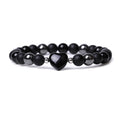 Hand-cut stone peach heart bracelet in Tigereye with geometric design and celestial moon planet motifs