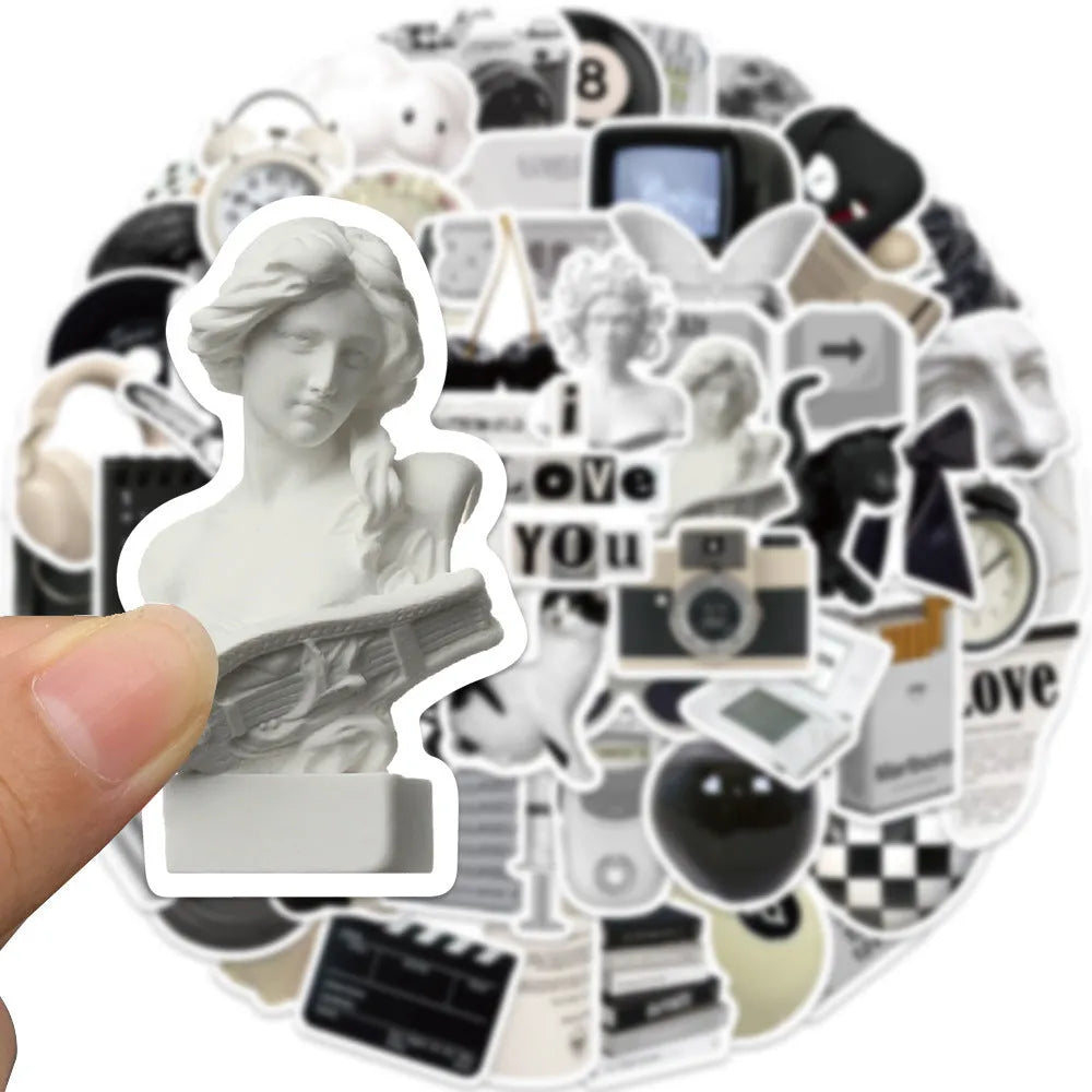 61-piece pack of black and white PVC waterproof decorative stickers laid flat.