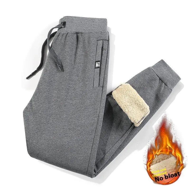 Men's grey fleece-lined cotton track pants with elastic waistband in oversized fit