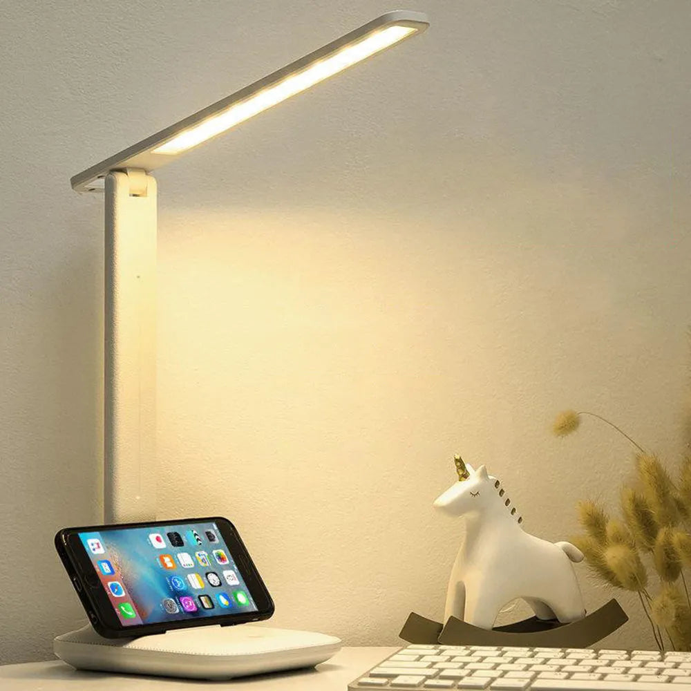 White plastic bedside lamp with touch dimming and USB charging port.
