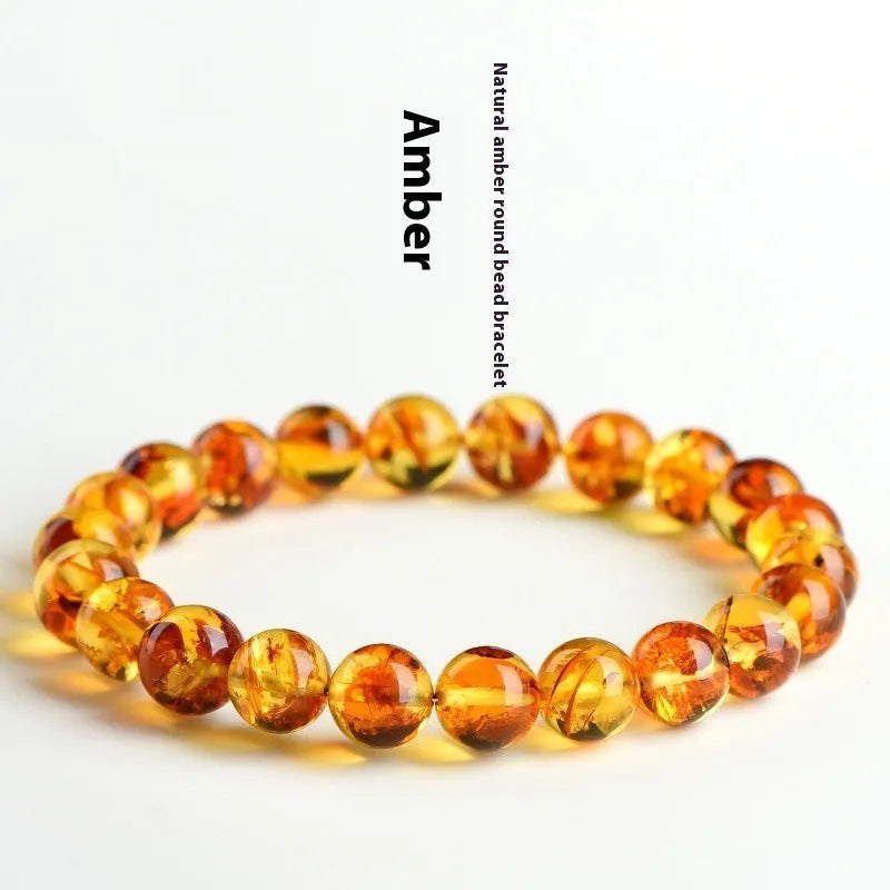 A natural yellow piebald amber bracelet with geometric beads for water purification.
