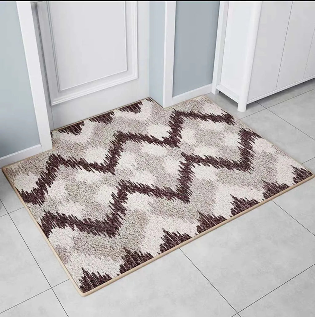 Modern minimalist rectangular floor mat in wave pattern on a tiled entrance floor