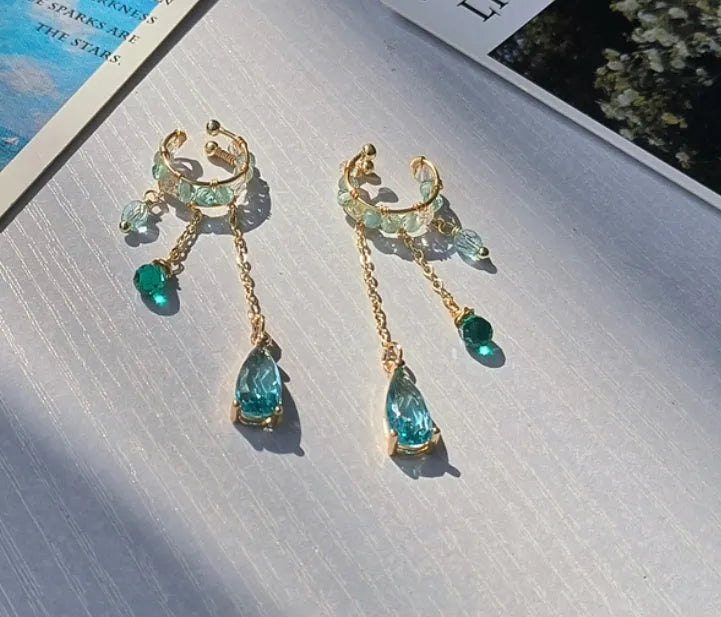 Niche ear clip with lake blue stream streamer in alloy silver plating for left ear original design