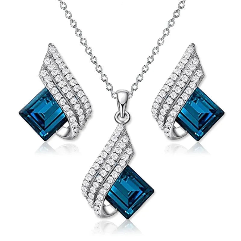 Women's electroplated alloy and glass jewellery set showing necklace with cross chain design and matching ear studs