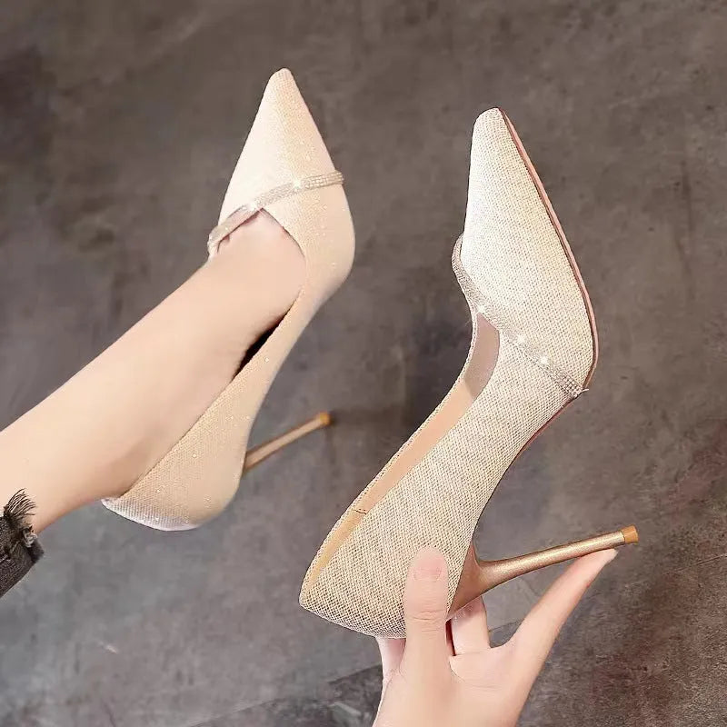 Women's black and gold stiletto pointed toe high heels with low cut design