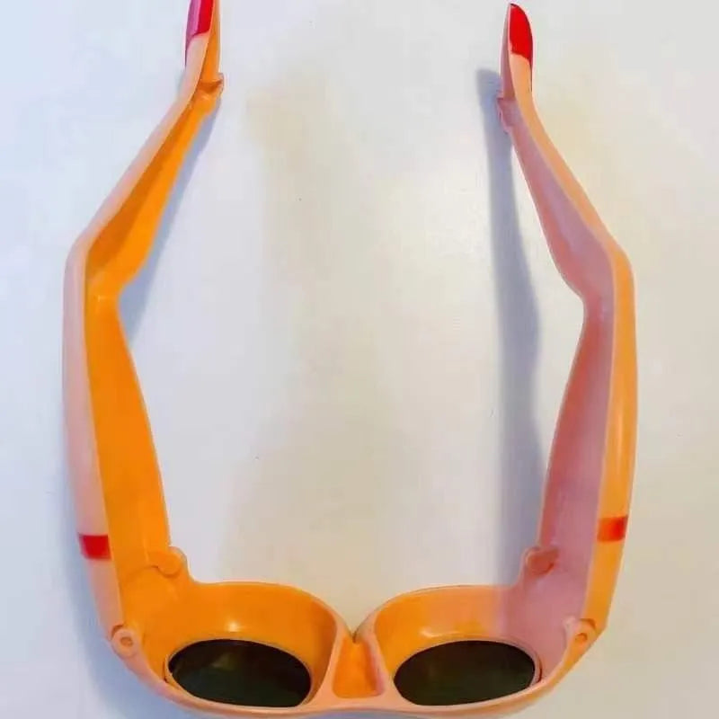 Orange novelty sunglasses with sculpted plastic leg attachments wrapped around head model.