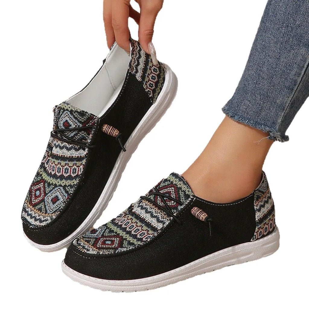 Women's flat round-toe low-top shoes in black, dark grey, or khaki with a rubber sole.