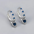 Gold-coloured clip-on earring for women with a heart-shaped drop featuring a pink zircon stone.