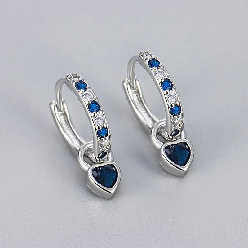 Gold-coloured clip-on earring for women with a heart-shaped drop featuring a pink zircon stone.