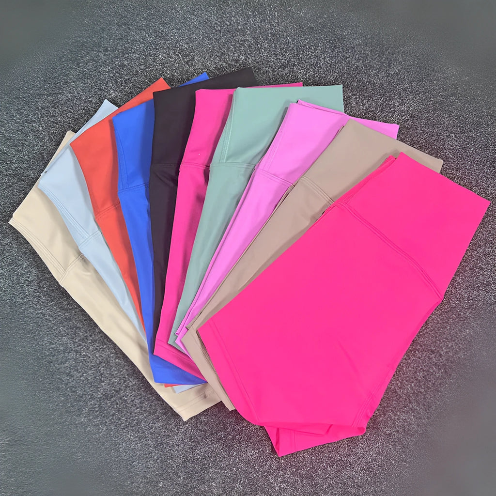 High-waisted women's yoga shorts in nylon fabric, shown in a selection of colours including pink litchi and cayenne red.
