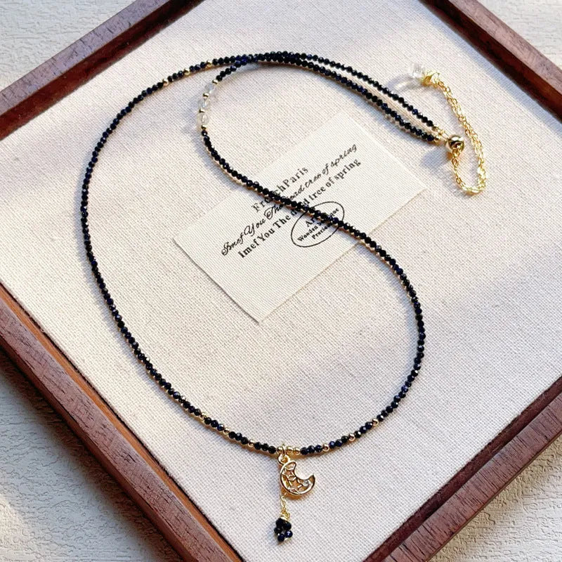 Blue gold sand stone three-ring multi-layer bracelet for women on a white background.