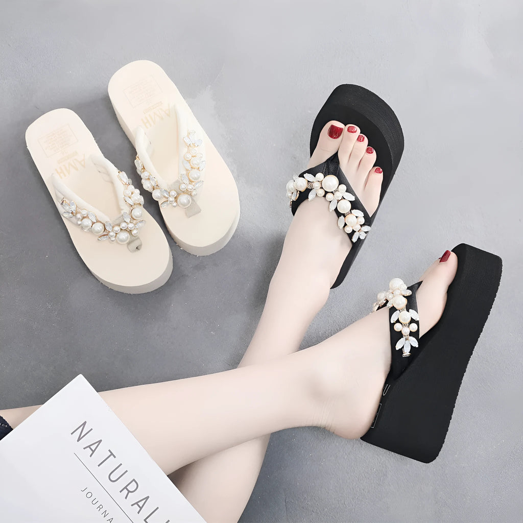 Women's beige high-heeled flip-flops with a cotton cloth upper on a summer background.