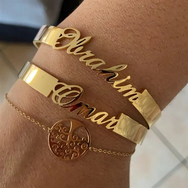 Customized name bracelet in stainless steel with silver, gold, or rose gold finish and 3mm, 6mm, or 10mm size options.